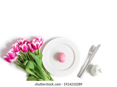 Easter Table Setting With Pink Tulips, Egg And Rabbit Isolated On A White Background. Easter Concept. Space For The Text. View From Above.