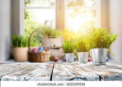Easter table with spring flowers in a sunny April kitchen - Shutterstock ID 1023359536