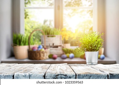 Easter table with spring flowers in a sunny April kitchen - Shutterstock ID 1023359563