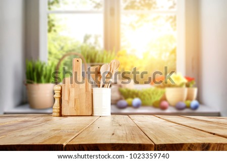 Easter table with spring flowers in a sunny April kitchen