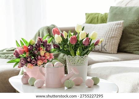 Easter Table with Tulip Bouquets, Eggs and Festive Decor. Cozy Spring Arrangement
