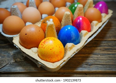 Easter tradition - Easter colorful chicken eggs on a gray background - Easter composition. - Selective focus