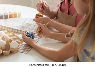 Easter Traditions. Little Child With Grandma Painting Eggs For Holiday, Closeup View