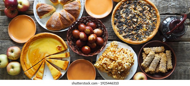 Easter Treats, Pastries And Eggs On An Ancient Wooden Table