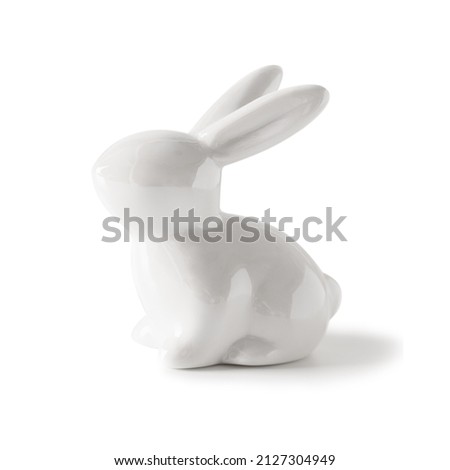 Easter white porcelain bunny isolated on white background. Close up.