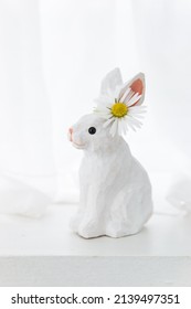 Easter wooden handmade bunny  with chamomile flower on ear