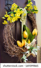 Easter Wreath. Spring Decoration On The Wooden Door Of The House