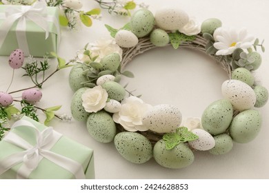 Easter wreath with white flowers, eggs and butterflies on light background - Powered by Shutterstock