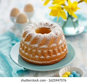 Easter Yeast Cake Sprinkled With Powdered Sugar On A Turquoise Plate. Traditional Easter Dessert In Poland