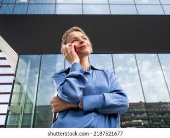 Eastern European Business Woman Talking On The Phone In A Financial District. Executive Woman, Entrepreneur Woman