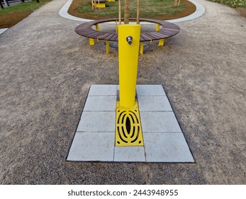 eastern oriental romantic style park with bench on ying yang mosaic tiles. drinking fountain with tap and sink for taking water healing mineral water - Powered by Shutterstock