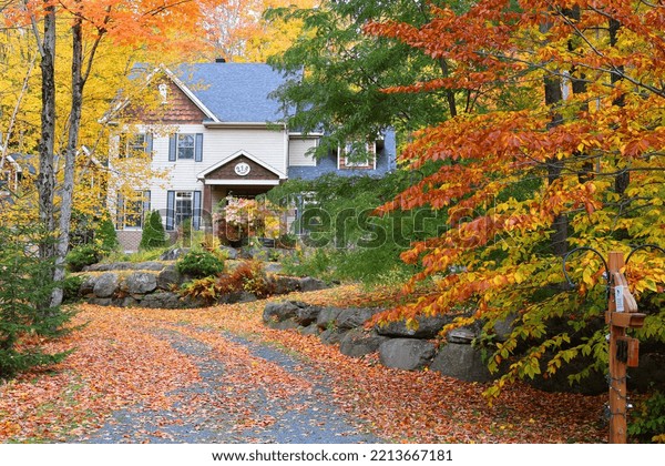 EASTERN TOWNSHIP QUEBEC CANADA 10 13 2022:\
Typical canadian house in fall landscape eastern townships  Quebec\
province Canada\
