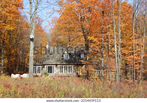 EASTERN TOWNSHIP QUEBEC CANADA 10 13 2022: Typical\
canadian house in fall landscape eastern townships  Quebec province\
Canada