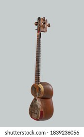 Eastern Traditional musical instrument tar. Tar is being used in medieval folklore of Persian, Armenian, Kurdish, Turkish music. Tar staying vertical on white - Shutterstock ID 1839236056