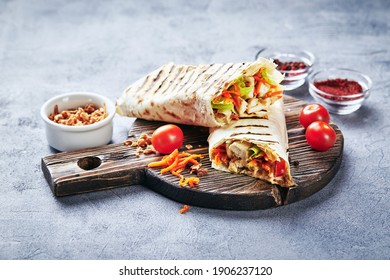 Eastern Traditional Shawarma With Chicken And Vegetables, Doner Kebab With Sauces On Slate. Fast Food. Eastern Food.