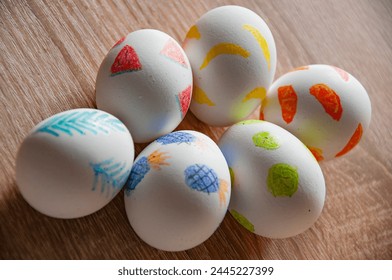 Eastertide and Eastertime. Good Friday. Hunting eggs. Painted eggs. Easter eggs on wooden table. Happy Easter holiday celebration. Easter bunny hunt. Spring holiday at Sunday. Easter egg painting.