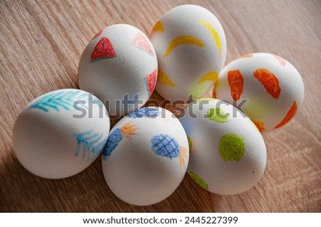 Eastertide and Eastertime. Good Friday. Hunting eggs. Painted eggs. Easter eggs on wooden table. Happy Easter holiday celebration. Easter bunny hunt. Spring holiday at Sunday. Easter egg painting.