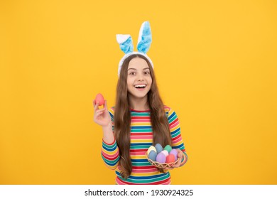 Eastertide. Time For Fun. Adorable Funny Kid On Egg Hunt. Easter Spring Holiday. Happy Teen Girl Wear Bunny Ears. Happy Easter. Childhood Happiness. Child In Rabbit Ears Hold Painted Eggs.