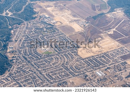 Eastvale, California, USA;  Aerial view of Eastvale california featuring Half Moon Park, Ronald Reagan Elementary School and Dairyland Park near the Santa Ana River
