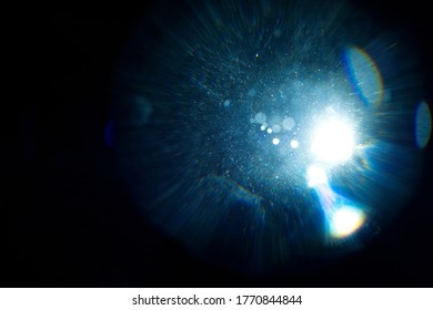 Easy to add lens flare effects for overlay designs or screen blending mode to make high-quality images. Abstract sun burst, digital flare, iridescent glare over black background.