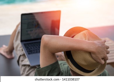 Easy relax business man lifestyle with computer in hotel resort sitting hands behind head for happy businessman people with work life balance. Simplify Your Life Week. International happiness day. - Powered by Shutterstock