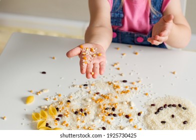 Easy Sensory Activities For Babies Toddler, Preschoolers. Little Girl Hands Playing With Rice, Popcorn, Beans, Pasta. Sensory Play At Home, Games For Sensory Processing Disorder, Activities Montessori