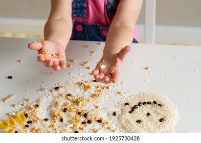 Easy Sensory Activities For Babies Toddler, Preschoolers. Little Girl Hands Playing With Rice, Popcorn, Beans, Pasta. Sensory Play At Home, Games For Sensory Processing Disorder, Activities Montessori