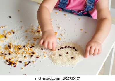 Easy Sensory Activities For Babies Toddler, Preschoolers. Little Girl Hands Playing With Rice, Popcorn, Beans, Pasta. Sensory Play At Home, Games For Sensory Processing Disorder, Activities Montessori