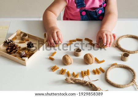 Easy sensory activities for babies toddler, preschoolers. Little girl hands playing with natural materials. Games for sensory processing disorder, activities Montessori