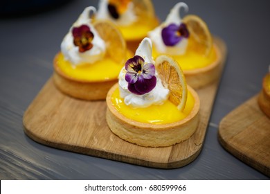 Eat delicious biscuit tart with citrus & cream.Italian pastry cafe menu item in close up.Enjoy fresh baked dessert in restaurant.Closeup shot of little sweet decorative cake  - Powered by Shutterstock