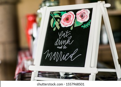 Eat, Drink, And Be Married Sign At Wedding Bar