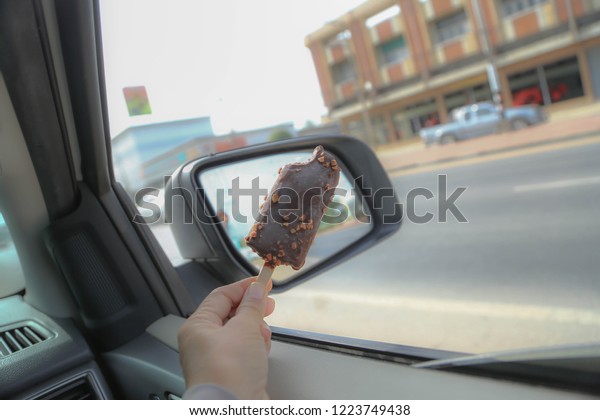 Eat ice cream while\
driving.
