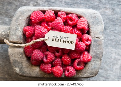 Eat More Real Food, Raspberries And A Tag With The Inscription