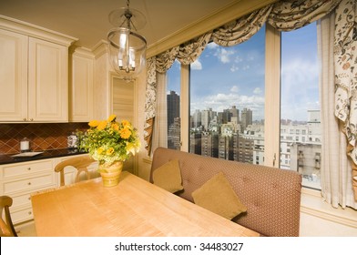 eat in nook dining area in kitchen with city views in penthouse luxury apartment in new york