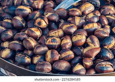 Eat roasted chestnuts. Roasted chestnuts for sale.