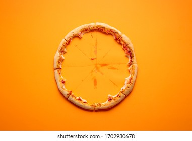 Eaten pizza context with pizza crust leftovers on an orange seamless background. Devoured pizza. Italian delicious food. Popular finger food. - Shutterstock ID 1702930678