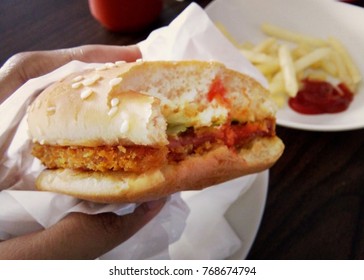 Eating Burger/ Hamburger Sandwich, Bitten Half, Close Up View, First Person Holding The Food