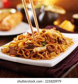 Eating Chinese Beef Lo Mein With Chopsticks