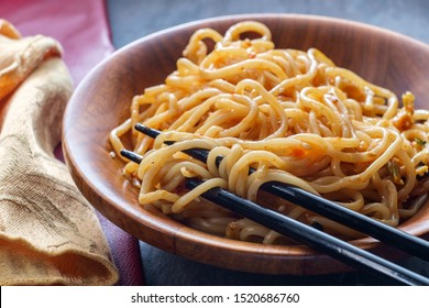 Eating Chinese Vegetable Lo Mein Noodles With Chopsticks