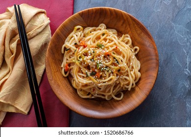 Eating Chinese Vegetable Lo Mein Noodles With Chopsticks