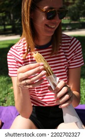 Eating Churros In Chilean Park