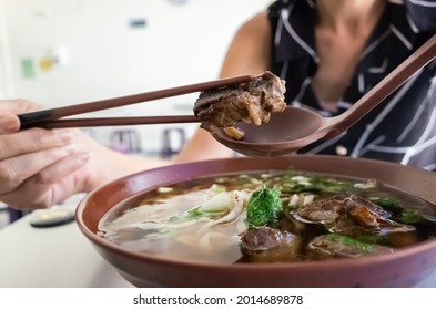 Eating Clear Stewed Beef Noodle Soup At Taiwan