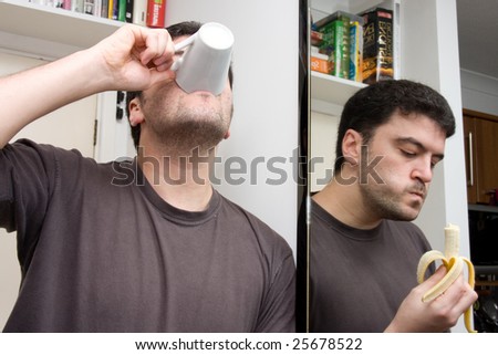 Eating and drinking reflection in a mirror