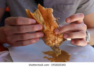 Eating a Dripping Philly Cheesesteak Whiz Wit - Shutterstock ID 1932025343