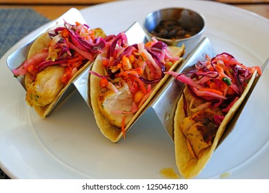 Eating Fish Tacos With Black Beans