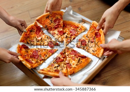 Eating Food. Close-up Of People Hands Taking Slices Of Pepperoni Pizza. Group Of Friends Sharing Pizza Together. Fast Food, Friendship, Leisure, Lifestyle.