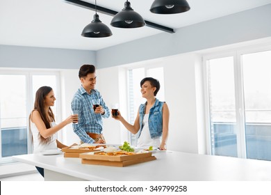 Eating Food. Group Of Happy Friends Having Dinner Party At Home. Cheerful People Laughing, Eating Pizza And Drinking Soda While Having Fun Together. Fast Food, Friendship, Leisure Concept.