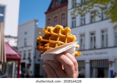 Eating Of Fresh Baked Hot Belgian Sugar Waffles, Street Food In Bruges