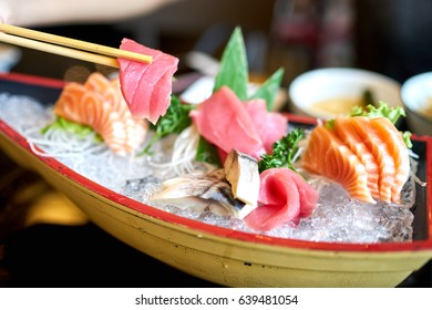 Eating Fresh Tuna And Salmon Sashimi, Japanese Food