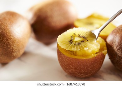 Eating Gold Kiwifruit With Spoon